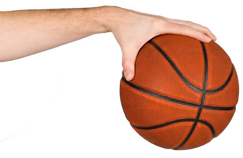 Isolated hand palming a basketball