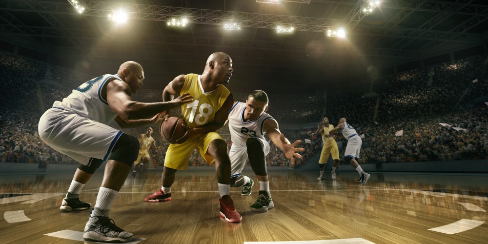 Professional basketball players fight for the ball